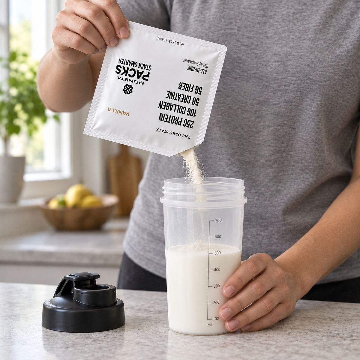 A person pours an opened Moneta PACK into a shaker